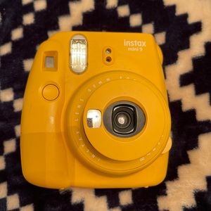 Cute yellow polaroid camera